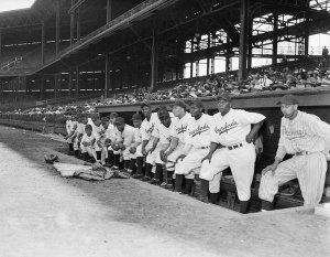 Charles "Teenie" Harris - Pittsburgh Crawfords Negro League baseball team posed in dugout at Forbes Field, 1945