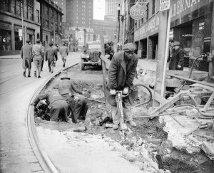 Charles "Teenie" Harris - Joseph Turner and other workers, digging up street in front of offices of Alderman John J. Lardo, Downtown Pittsburgh, ca. 1947