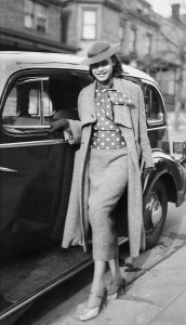 Charles "Teenie" Harris - Woman posed next to car on Mulford Street, Homewood, ca. 1937