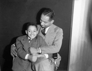 Charles "Teenie" Harris - Self-portrait of Charles "Teenie" Harris with son, Charles A. "Little Teenie" Harris, in Harris Studio, ca. 1937