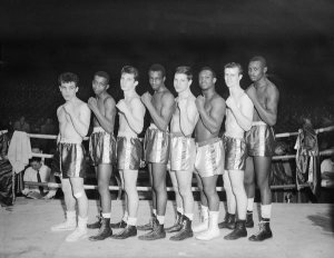 Charles "Teenie" Harris - Boxers, possibly Golden Gloves contenders, lined up in boxing ring, ca. 1955