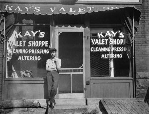 Charles "Teenie" Harris - Woman outside of Kay's Valet Shoppe, Hill District, Pittsburgh, ca. 1938-1945