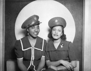 Charles "Teenie" Harris - Two women wearing U.S. Army caps, posed in Harris Studio, ca. 1940-1945