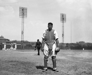 Charles "Teenie" Harris - Homestead Grays baseball catcher Josh Gibson standing on Forbes Field, 1942