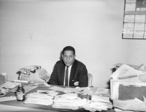 Charles "Teenie" Harris - Portrait of Bill Nunn Jr., possibly in Pittsburgh Courier Newspaper office, ca. 1952