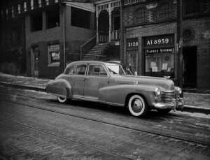 Charles "Teenie" Harris - Charles "Teenie" Harris's 1941 Cadillac Fleetwood parked in front of his studio at 2128 Centre Avenue, Hill District, ca. 1941-1945