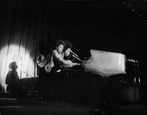 Charles "Teenie" Harris - Double exposure of Nina Simone and guitar player performing on stage of Hilton Hotel ballroom, 1968-1969