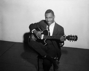 Charles "Teenie" Harris - George Benson holding Guild electric guitar, ca. 1959