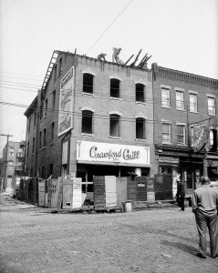 Charles "Teenie" Harris - Workers demolishing roof of Crawford Grill No. 1, Hill District, 1956