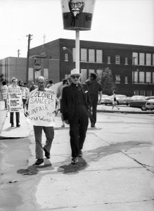 Charles "Teenie" Harris - United Farm Workers protesters carrying signs outside Kentucky Fried Chicken, 1971