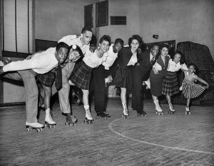 Charles "Teenie" Harris - Group portrait, possibly of the Gay Amigos Roller Skating Club, posed in gymnasium, ca. 1938-1950