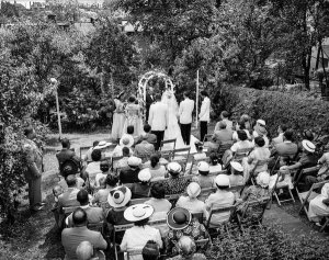 Charles "Teenie" Harris - Elder Harry Dobbins performing wedding ceremony for bride Ethel Roberta Smith Walker and Franklin Walker Jr., Hill District, June 28, 1953