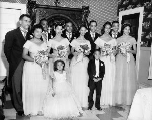 Charles "Teenie" Harris - Group portrait of attendants for Thomas--McGuire wedding, posed in Greene Hearth, October 3, 1953