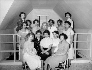 Charles "Teenie" Harris - Members of Kolesque Club posed in front of railing in interior, ca. 1950
