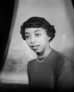 Charles "Teenie" Harris - Portrait of Joan Bruce wearing dark sweater and pearl necklace, in Harris Studio, 1950