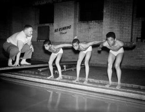 Charles "Teenie" Harris - Three boys preparing to dive at Centre Avenue YMCA indoor swimming pool, April 1956
