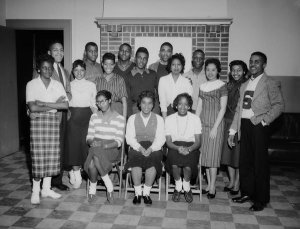 Charles "Teenie" Harris - Group portrait of Schenley High School graduates posed in Centre Avenue YMCA, April 1958