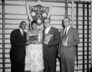 Charles "Teenie" Harris - Donald McCreary, presenting community services plaques during Y-Phalanx Fraternity banquet, Centre Avenue YMCA, March 1960