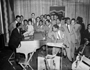 Charles "Teenie" Harris - Earl "Fatha" Hines with band members, including Billy Eckstine and Budd Johnson, at the Savoy Ballroom, Hill District, c. 1939-1940