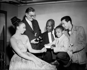 Charles "Teenie" Harris - Josephine Baker accepting Hill City membership card from Leslie Powell, with George Fairley holding police badges honoring Dean Martin and Jerry Lewis