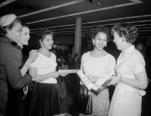 Charles "Teenie" Harris - Group portrait of five women gathered at the Courier Home Service Fair in the Syria Mosque, 1957
