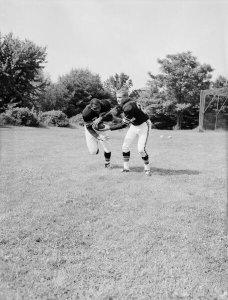Charles "Teenie" Harris - Pittsburgh Steelers football players John Henry Johnson receiving ball from Bobby Layne, July 1961